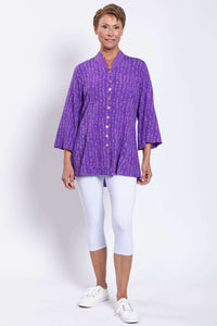 Front facing model in Mar Violet Print Blouse and white cropped pants