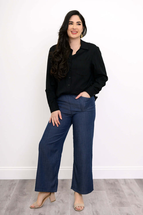 Model wearing Parker tencel wide leg pants with black shirt and heels