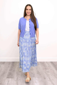 Model wearing Roma tiered blue floral skirt with short-sleeve cardigan
