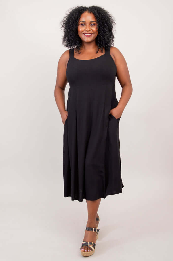 Model with hands in pockets wearing the black bamboo linen dress