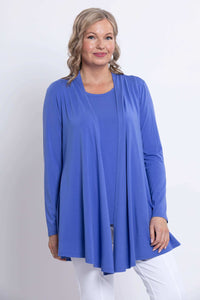 Woman modeling a blue bamboo long sleeve open jacket, smiling, hands relaxed by her sides