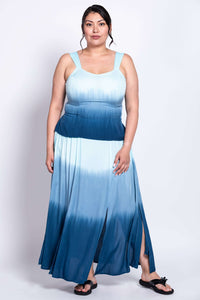Woman in blue ombre maxi dress with flowy skirt and wide straps