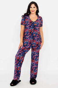 Model in full matching floral lounge set smiling with hands at sides