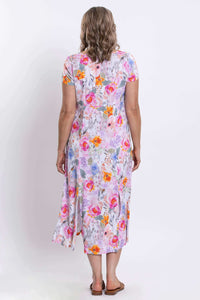 Back view of the floral button-front dress showing empire waist and flowing skirt