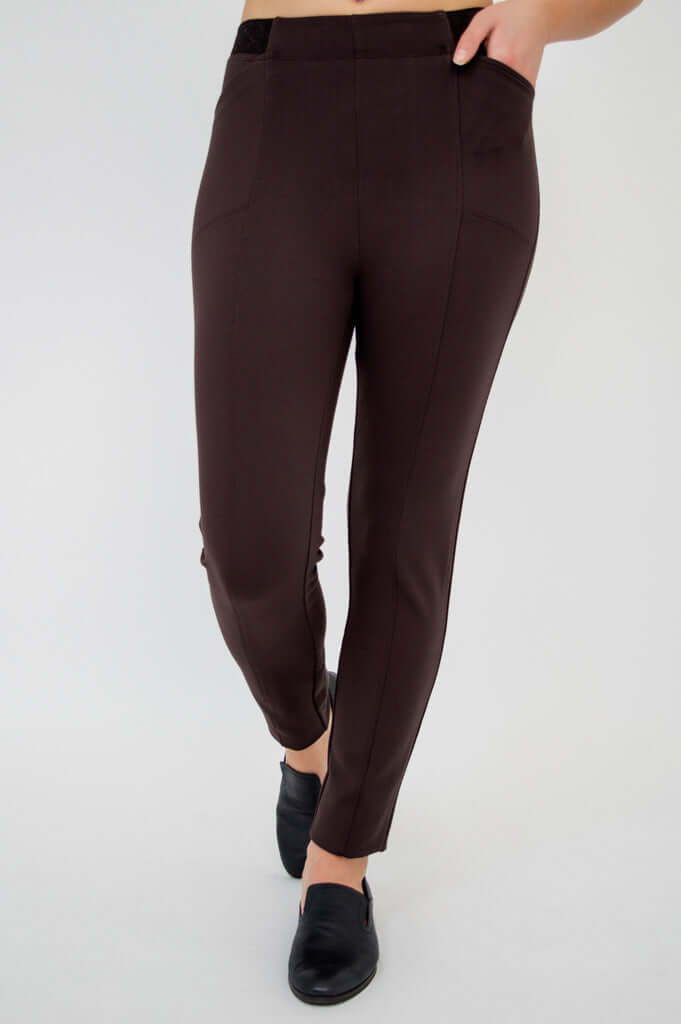 Close-up of Nadia slim-line pants in brown with hidden pockets and seam detailing