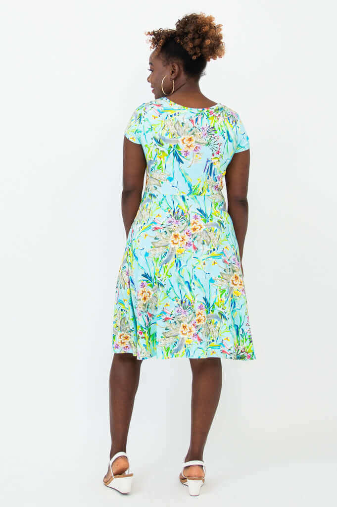 Rear view of woman in Nicola blue floral cap sleeve A-line dress