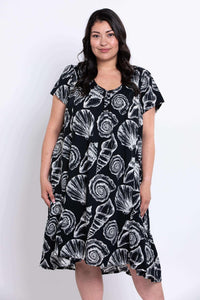Closer front view of Noosa Dress showing white shell pattern on black fabric
