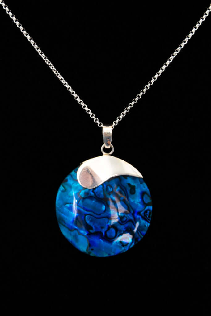 Round ocean-blue shell pendant necklace with sterling silver accent on a chain