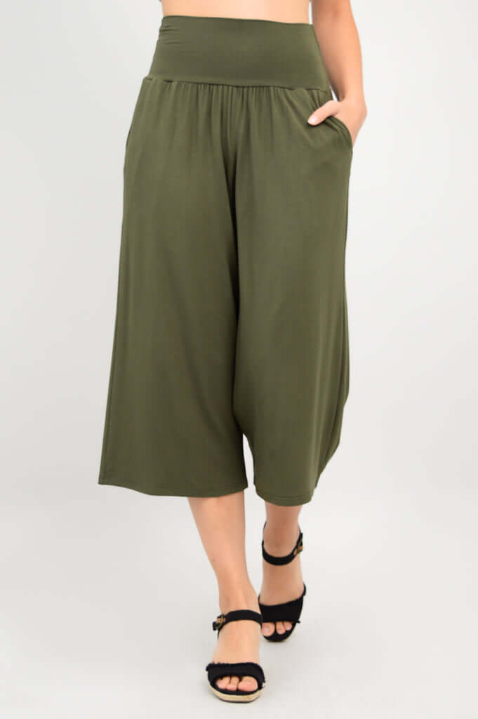 Olive green bamboo palazzo capri pants with pockets, model hand in pocket