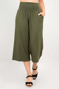 Olive green bamboo palazzo capri pants with pockets, model hand in pocket