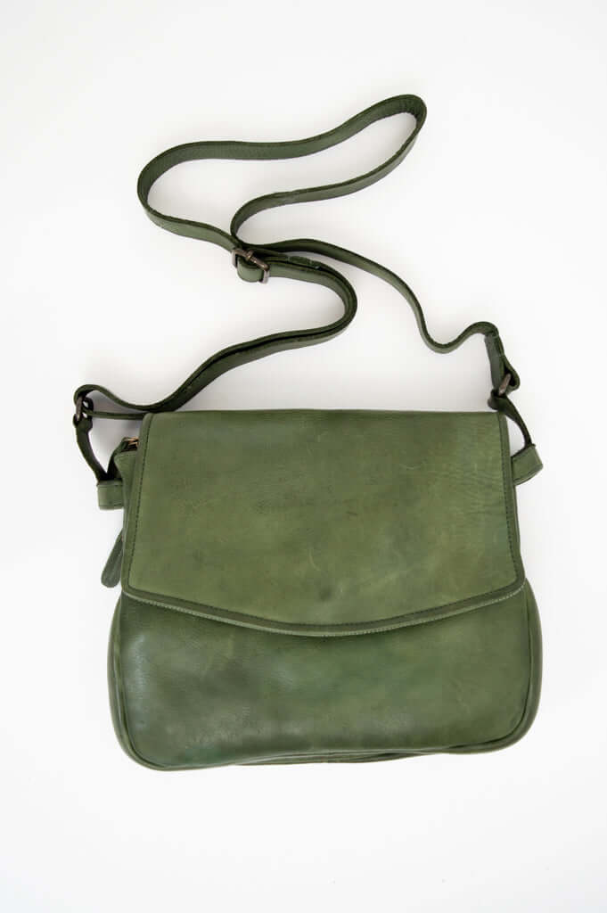 Front view of an olive green leather crossbody bag with adjustable shoulder strap