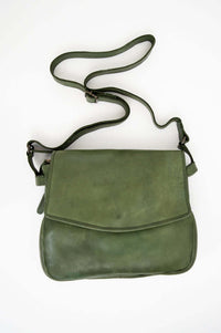Front view of an olive green leather crossbody bag with adjustable shoulder strap
