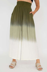 Olive ombre wide leg pants modeled with hand in pocket