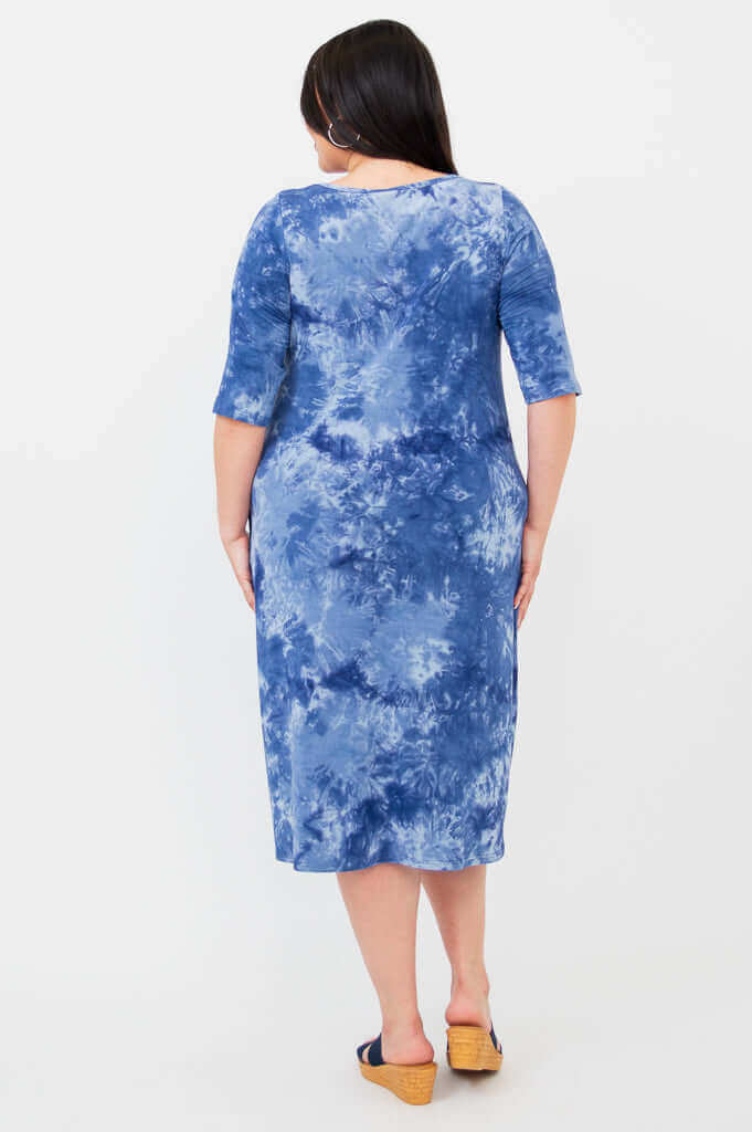 Back view of Olivia dress in blue tie dye worn by plus size model