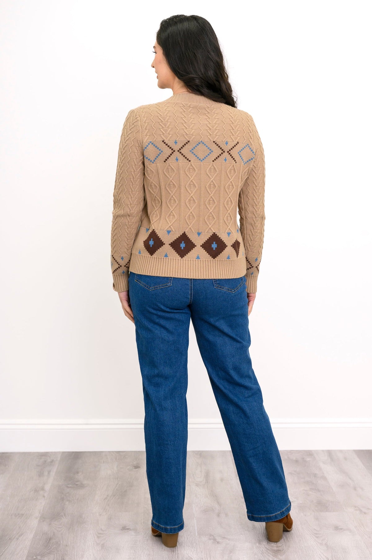 Back view of a beige geometric print sweater, showcasing the continuous pattern across the back and ribbed hem.