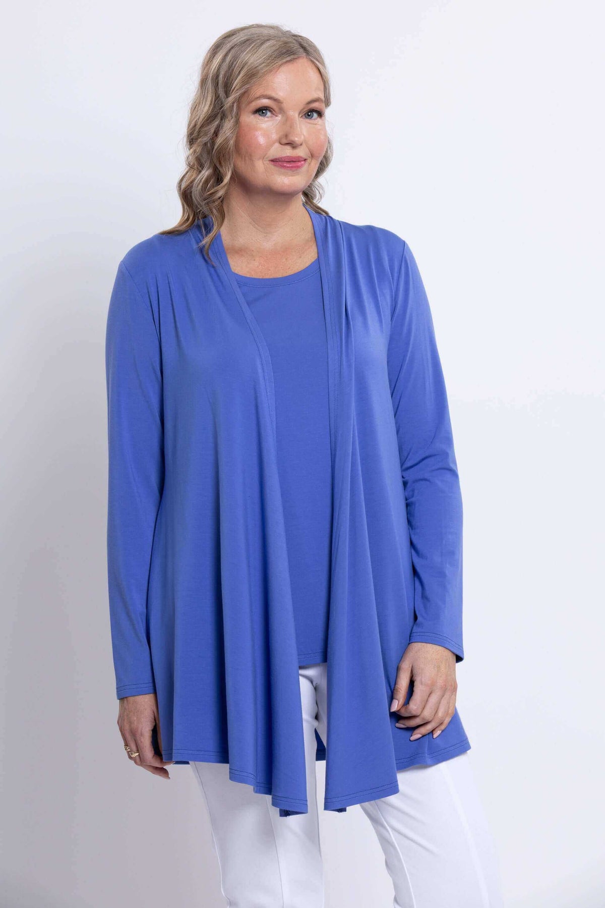 Front close-up of model wearing Opra open front jacket in cobalt blue