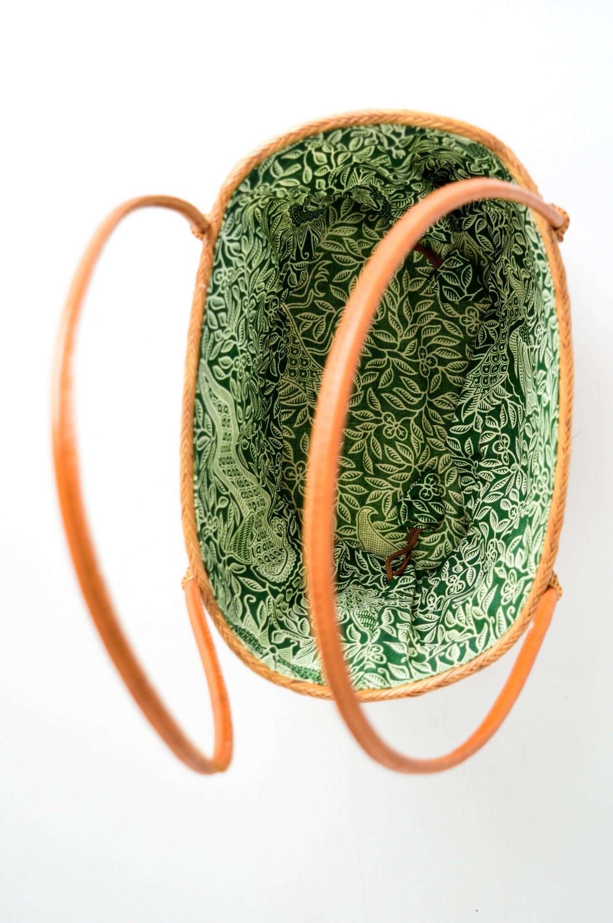 Overhead view of basket revealing spacious green patterned interior