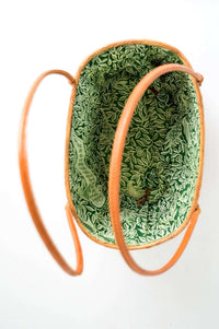 Overhead view of basket revealing spacious green patterned interior