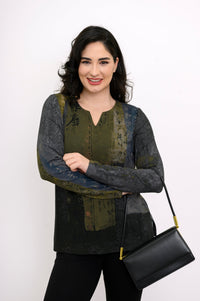 Three-quarter front view of a green patterned long-sleeve top showing side slits and a sweetheart neck.