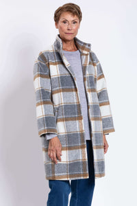 Woman wearing a plaid wool coat with high collar and relaxed fit