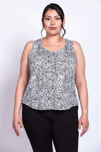Plus-size model wearing black and white rose print sleeveless tank