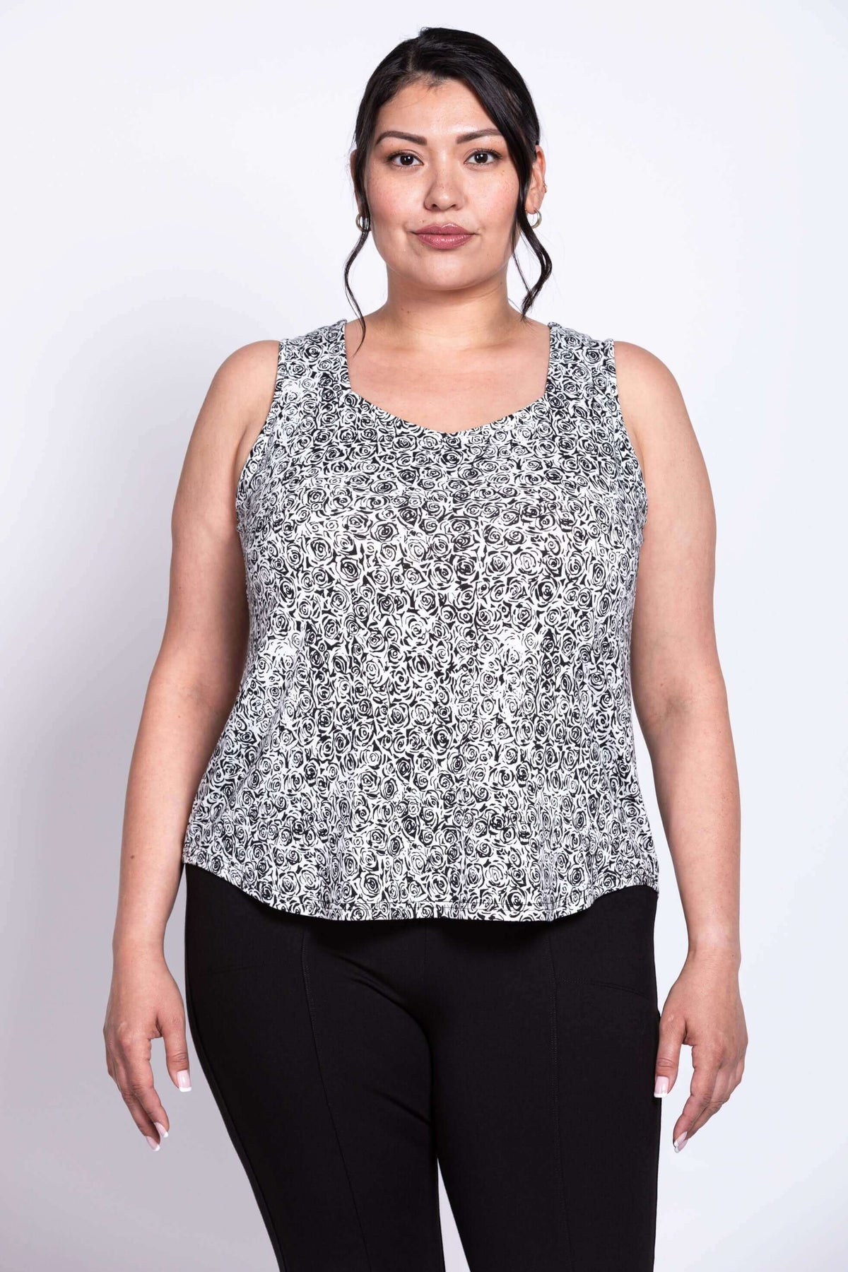 Plus size model wearing black and white rose print Ritzy Tank, front view