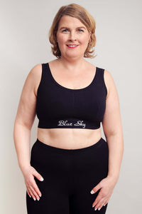Front view of plus size woman in Blue Sky black comfort bra and pants