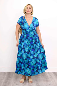 Plus size model in blue floral bamboo maxi dress with hand in pocket