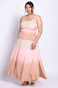 Plus size model showing side movement of ombre maxi dress in beige, pink, and peach