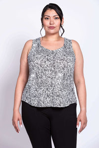 Plus size model in front view of black and white rose tank top with sweetheart neckline