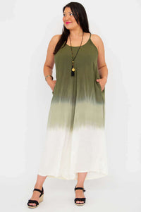 Plus size model wearing green and white gradient jumpsuit with pockets
