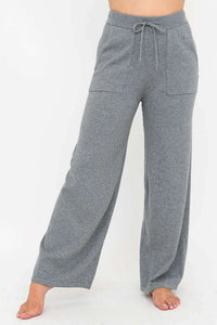 Full front view of grey wide leg lounge pants showing relaxed fit and elastic waistband