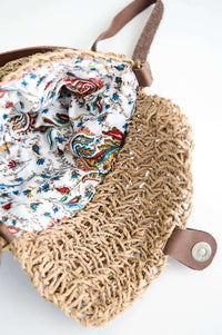 Printed inner lining of the woven rattan purse with floral pattern