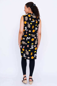 Back view displaying the high-low hemline of the Queenie abstract tunic