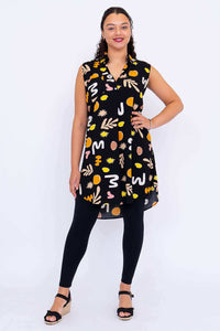 Full body front view of Queenie sleeveless tunic paired with black leggings