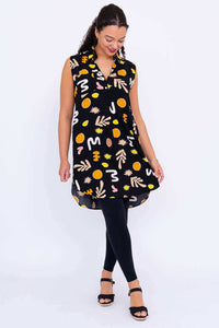 Model looking down while showing the flow of the Queenie abstract tunic dress