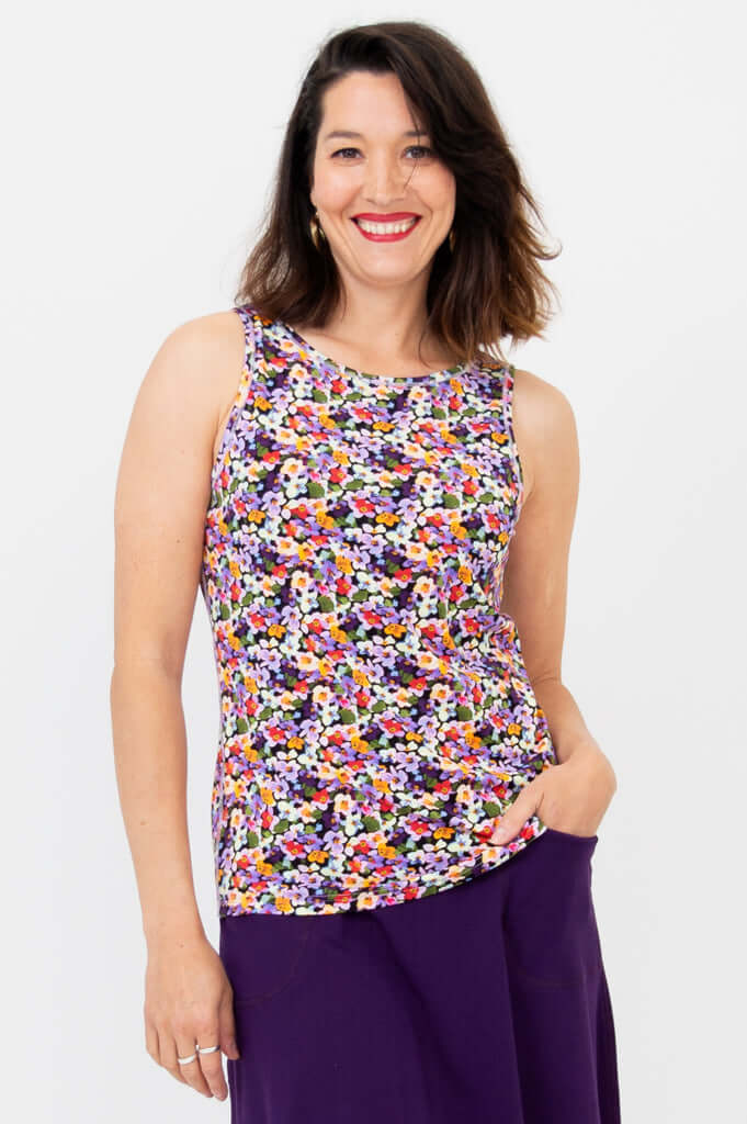 Woman modeling Reanna reversible bamboo tank with floral print and high neckline, front view