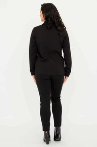 Back view of tailored black jacket and fitted black pants