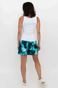 Woman modeled from behind in Melly Skort in Arctic Blue and white tank top