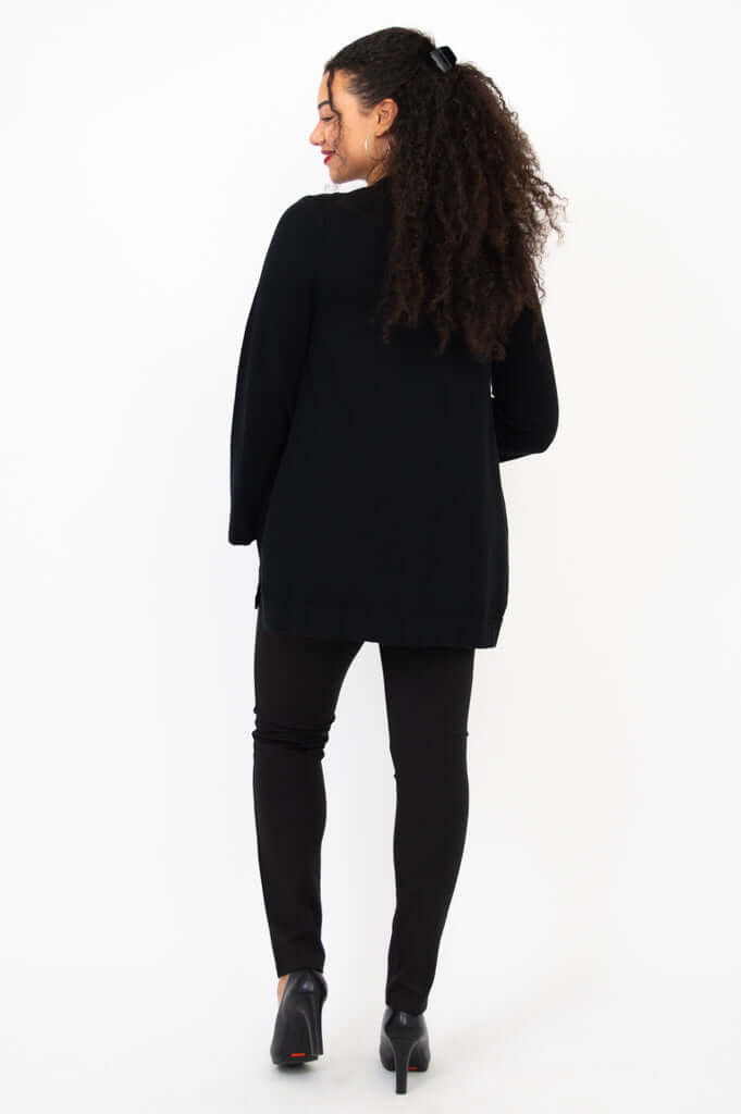 Back view of model in black Dallas Cardigan, showing relaxed fit