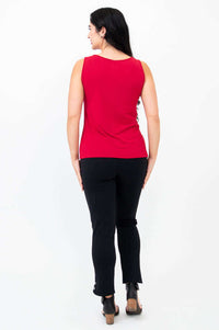 Back view of woman showcasing the fit of a red tank top with black pants