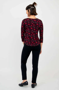 Back view of model showcasing Ritzy Top Lotus Black and black pants