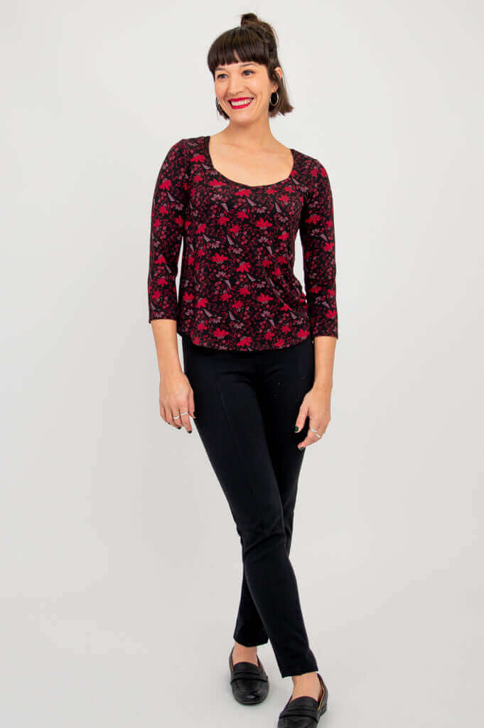 Full body front view of model in Ritzy Top Lotus Black paired with black pants