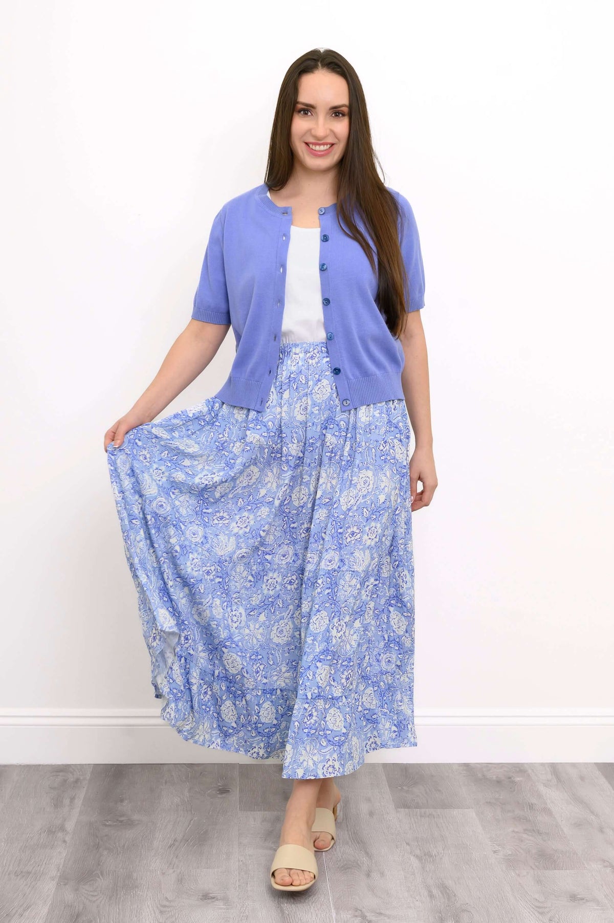 Roma blue floral tiered skirt displayed with a flared hem
