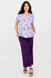 Full body view of model in Samantha watercolor shirt and purple pants