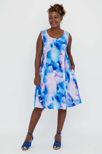 Model in blue watercolor sleeveless A-line Sara dress with pockets