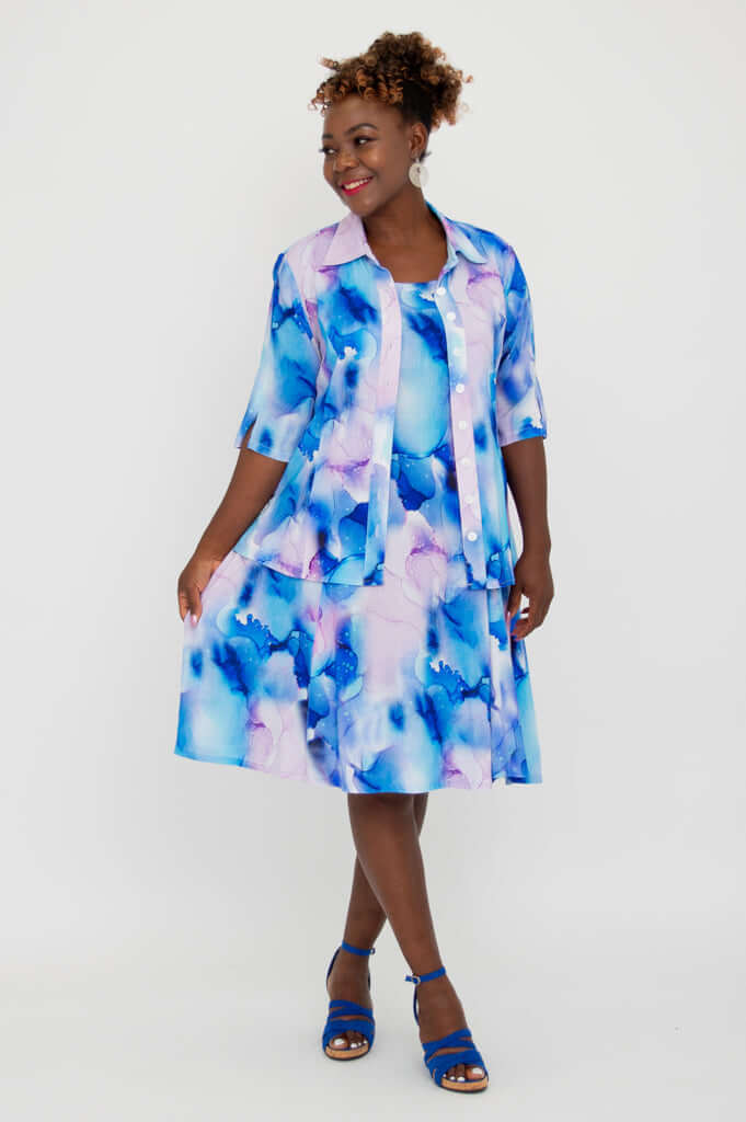 Model wearing blue watercolor Sara dress and matching button-up top