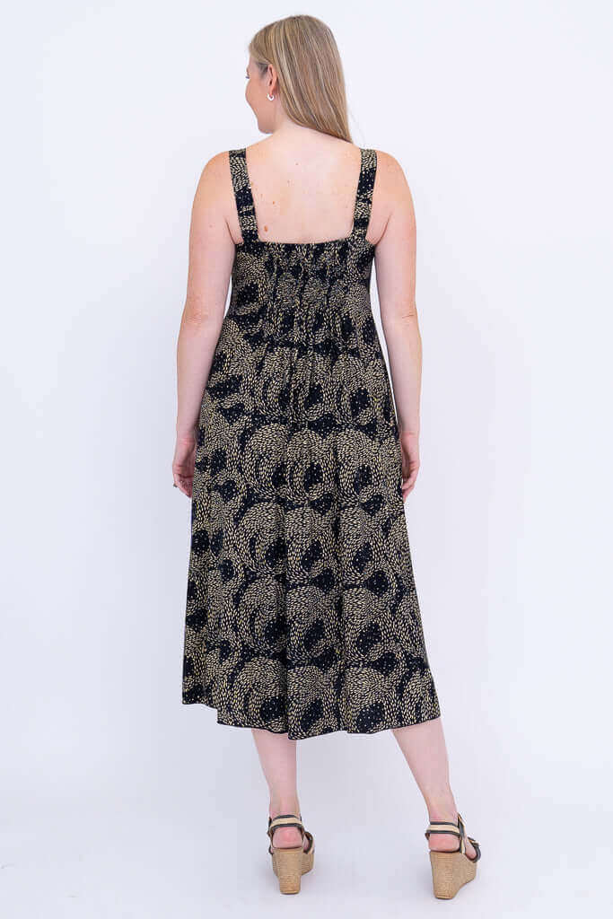 Back view of woman wearing Shauna dress, showing shirred bodice detail