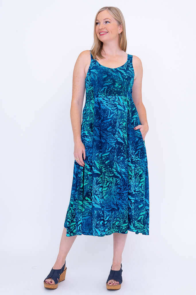 Model with hands in pockets of Shauna midi dress, Lagoon print