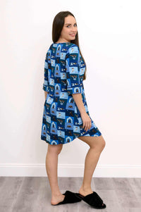 Woman showing side and back of blue dog print bamboo sleepshirt